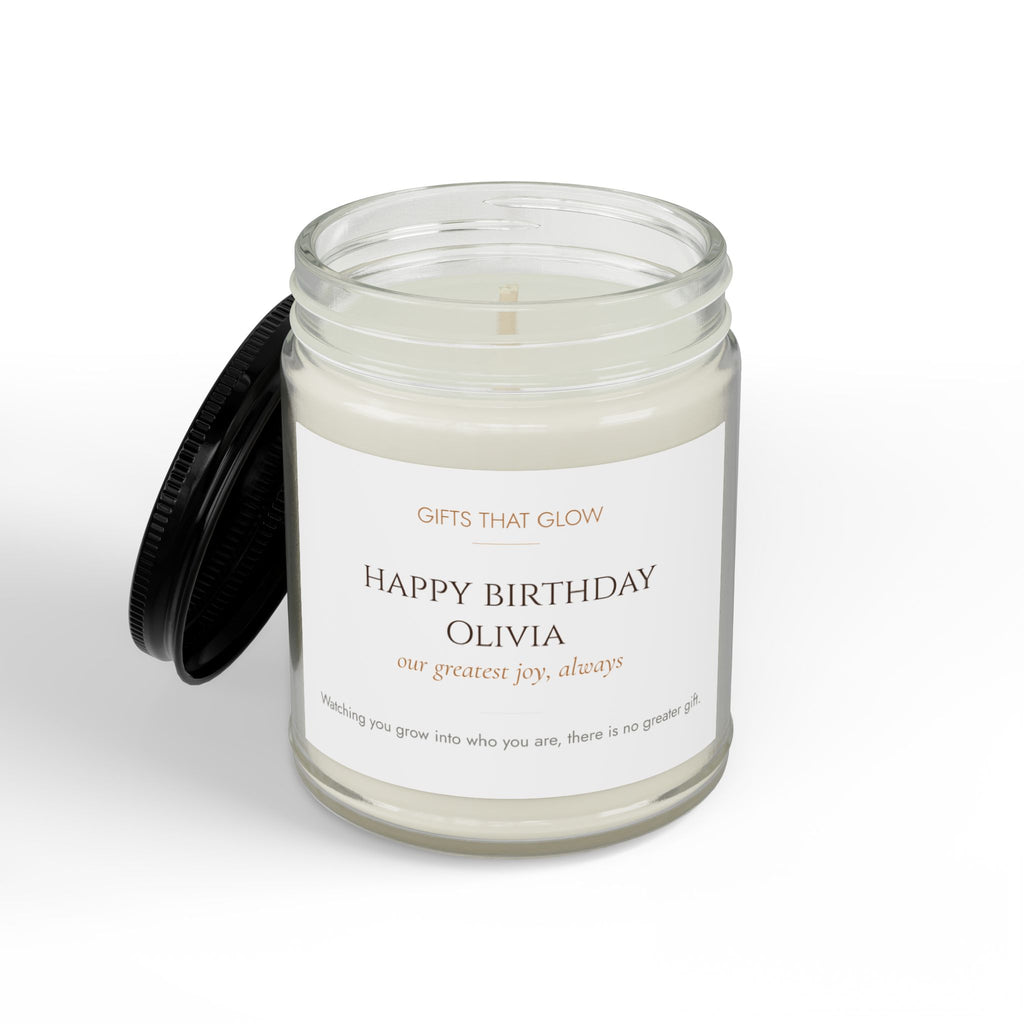 Daughter birthday candle label close-up — personalized name and message in warm copper serif typography